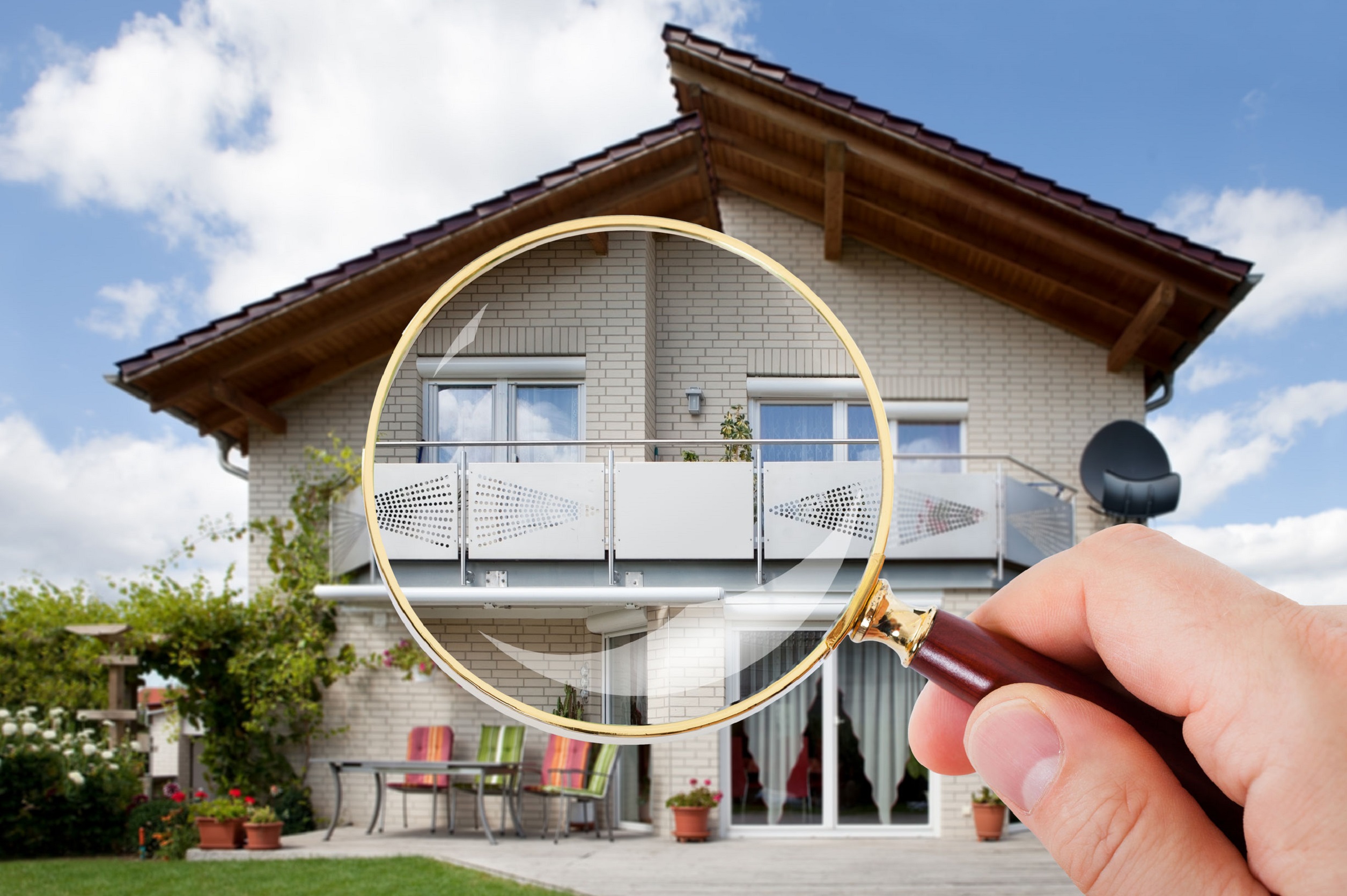 Hand With Magnifying Glass Over House Person Hand With Magnifying Glass Over Luxury House